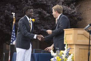 Student receives his diploma
