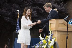 Student receives her diploma